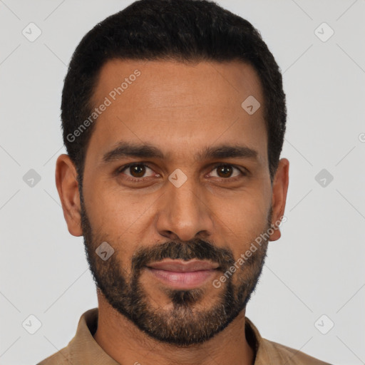 Joyful black young-adult male with short  black hair and brown eyes