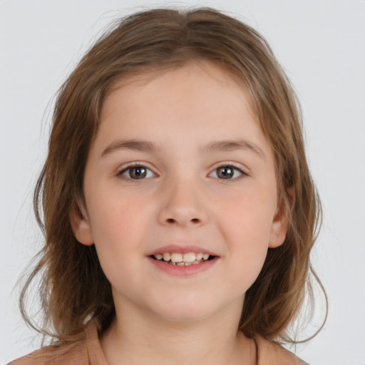 Joyful white child female with medium  brown hair and brown eyes