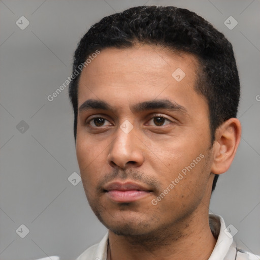 Neutral latino young-adult male with short  black hair and brown eyes