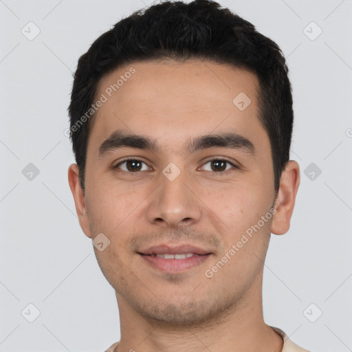 Joyful white young-adult male with short  black hair and brown eyes