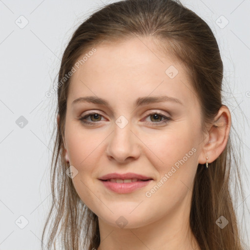 Joyful white young-adult female with long  brown hair and grey eyes