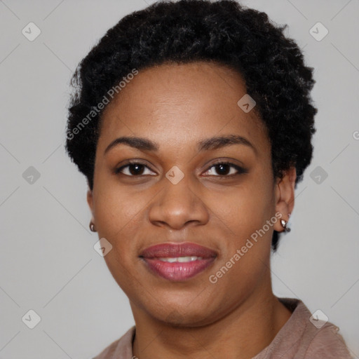 Joyful black young-adult female with short  black hair and brown eyes