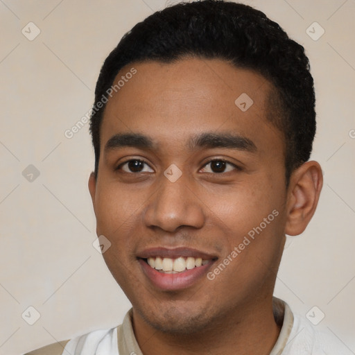 Joyful black young-adult male with short  black hair and brown eyes