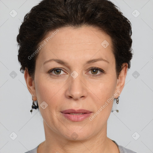 Joyful white adult female with short  brown hair and brown eyes