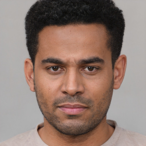 Neutral latino young-adult male with short  black hair and brown eyes