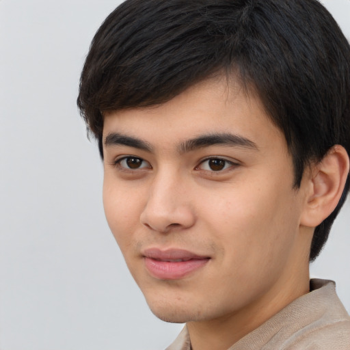 Joyful latino young-adult male with short  brown hair and brown eyes