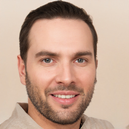 Joyful white young-adult male with short  brown hair and brown eyes