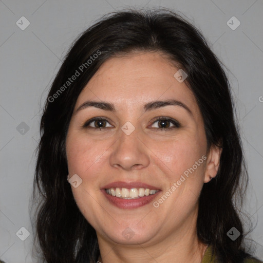 Joyful white adult female with medium  brown hair and brown eyes