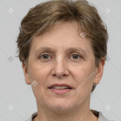 Joyful white adult female with short  brown hair and grey eyes