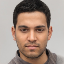 Neutral white young-adult male with short  black hair and brown eyes