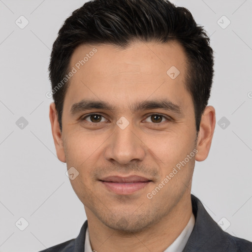 Joyful white young-adult male with short  black hair and brown eyes