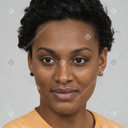 Joyful black young-adult female with short  brown hair and brown eyes