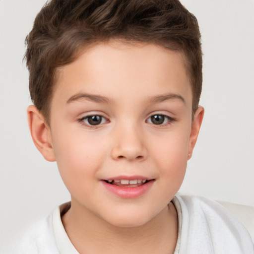 Joyful white child male with short  brown hair and brown eyes