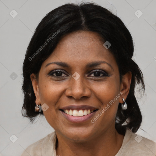 Joyful black adult female with medium  black hair and brown eyes