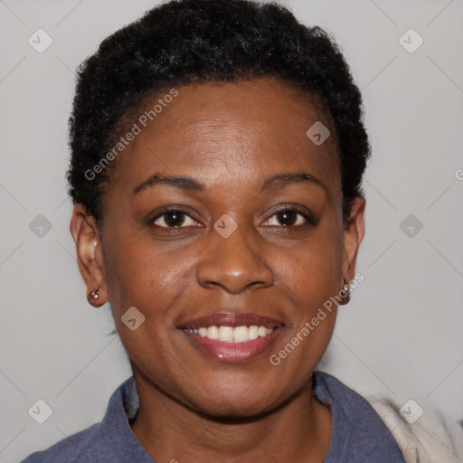 Joyful black adult female with short  brown hair and brown eyes