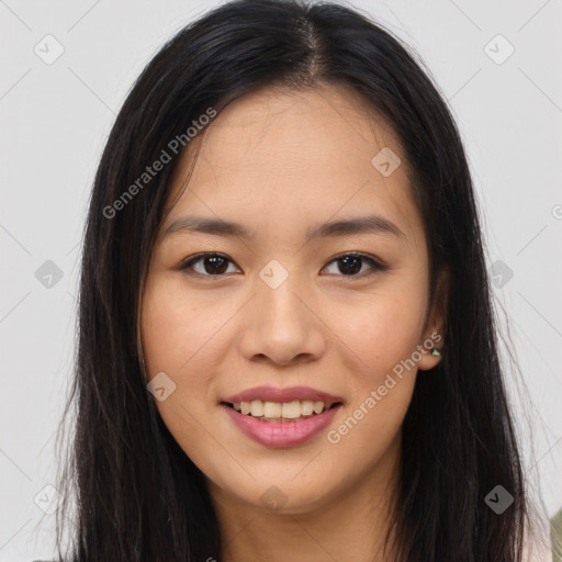 Joyful asian young-adult female with long  brown hair and brown eyes