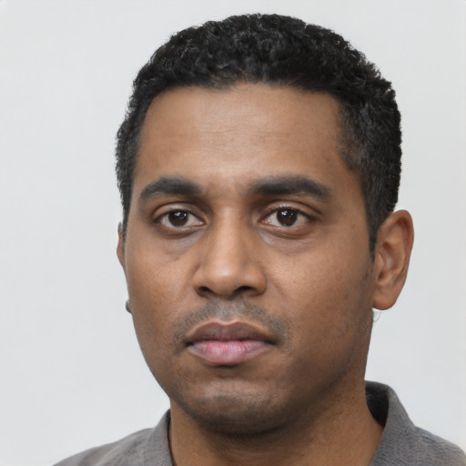 Neutral black young-adult male with short  black hair and brown eyes