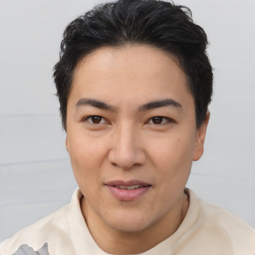 Joyful asian young-adult female with short  brown hair and brown eyes