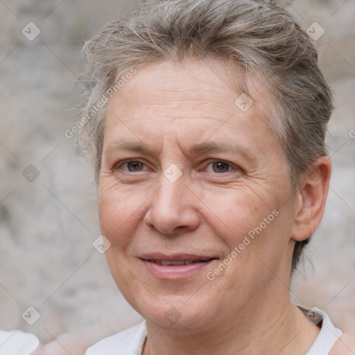 Joyful white adult female with short  brown hair and brown eyes