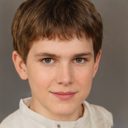 Joyful white child male with short  brown hair and grey eyes