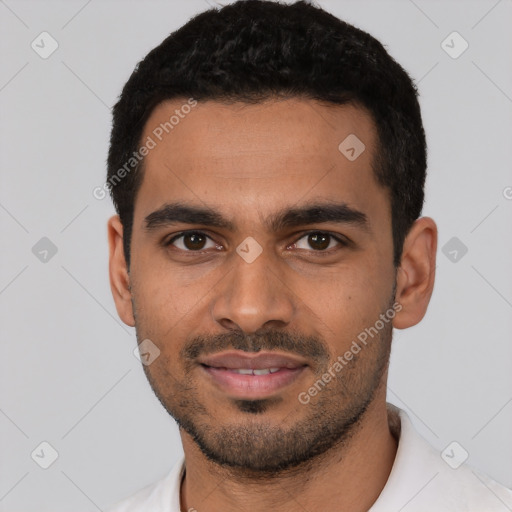 Joyful latino young-adult male with short  black hair and brown eyes