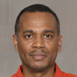 Neutral latino adult male with short  black hair and brown eyes
