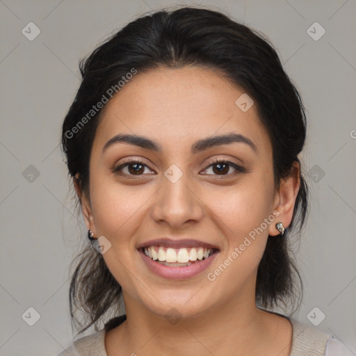 Joyful latino young-adult female with medium  brown hair and brown eyes