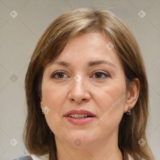 Joyful white adult female with medium  brown hair and brown eyes