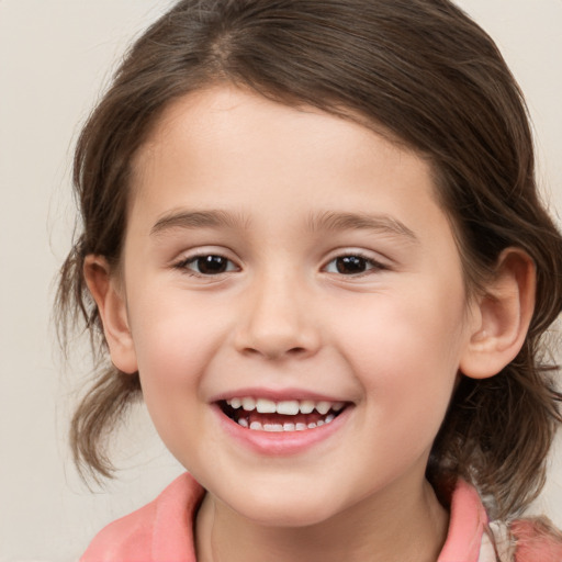 Joyful white child female with medium  brown hair and brown eyes