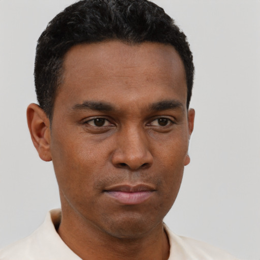 Neutral latino young-adult male with short  brown hair and brown eyes