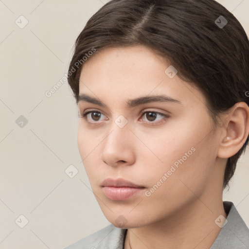 Neutral white young-adult female with short  brown hair and brown eyes