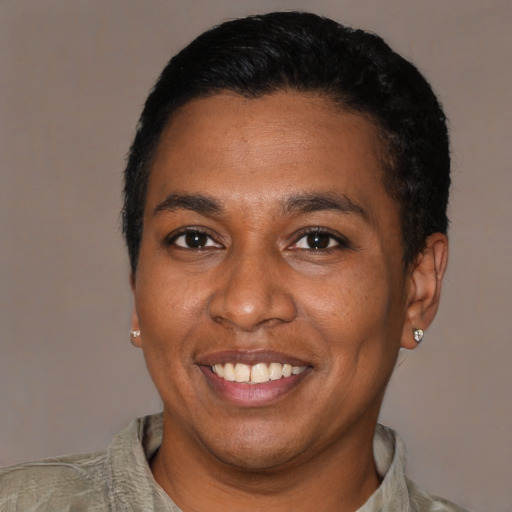 Joyful latino adult male with short  black hair and brown eyes