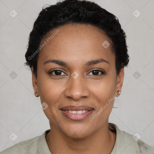 Joyful black young-adult female with short  black hair and brown eyes