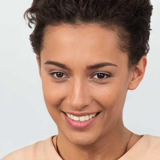 Joyful white young-adult female with short  brown hair and brown eyes