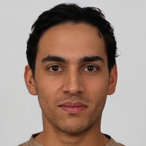 Neutral latino young-adult male with short  black hair and brown eyes