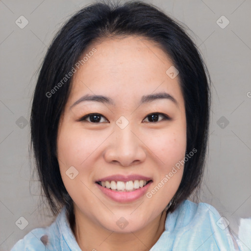 Joyful asian young-adult female with medium  black hair and brown eyes