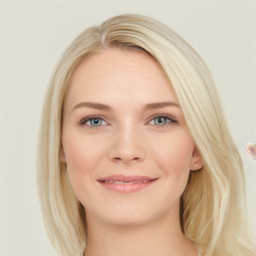 Joyful white young-adult female with long  brown hair and blue eyes