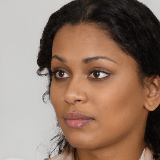 Neutral black young-adult female with long  black hair and brown eyes