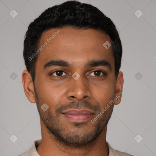 Joyful latino young-adult male with short  black hair and brown eyes