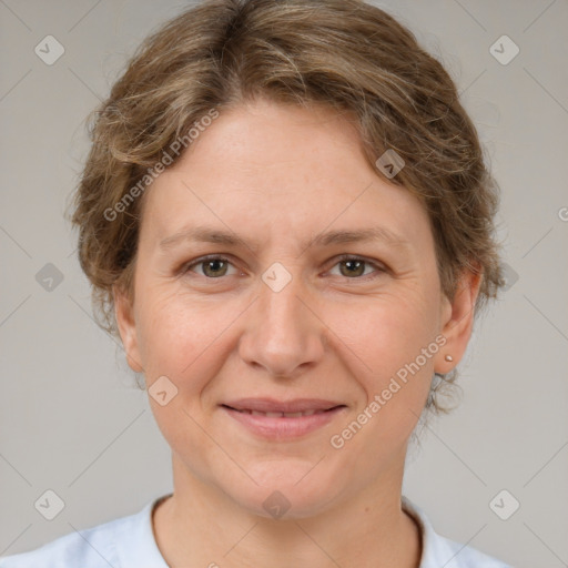 Joyful white adult female with short  brown hair and brown eyes