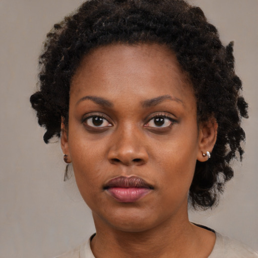 Neutral black young-adult female with medium  black hair and brown eyes