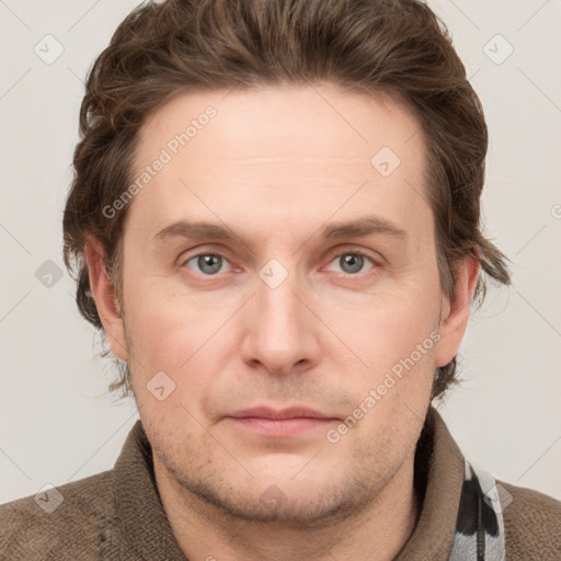 Joyful white adult male with short  brown hair and grey eyes