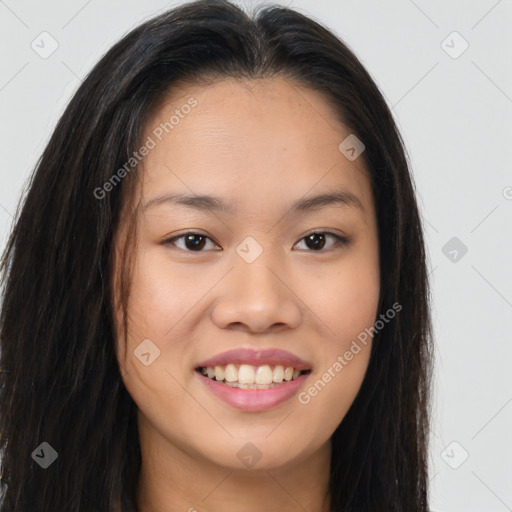 Joyful asian young-adult female with long  brown hair and brown eyes