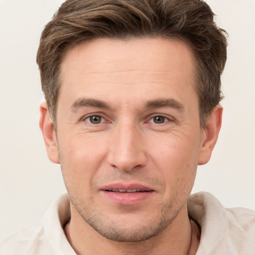 Joyful white adult male with short  brown hair and brown eyes