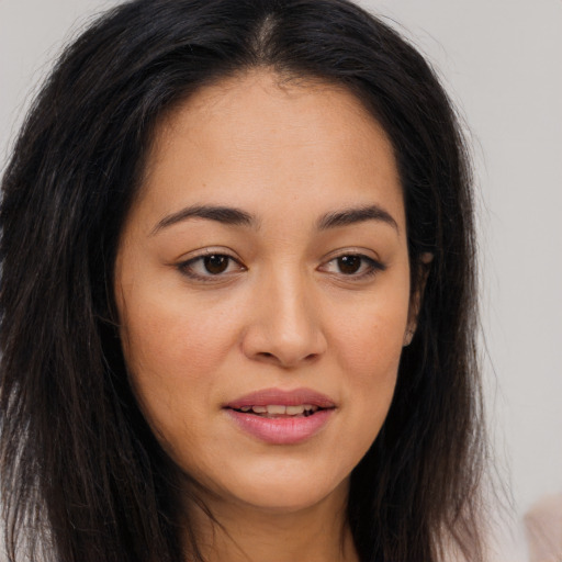 Joyful white young-adult female with long  brown hair and brown eyes