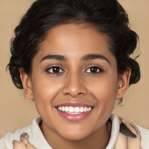 Joyful latino young-adult female with medium  brown hair and brown eyes