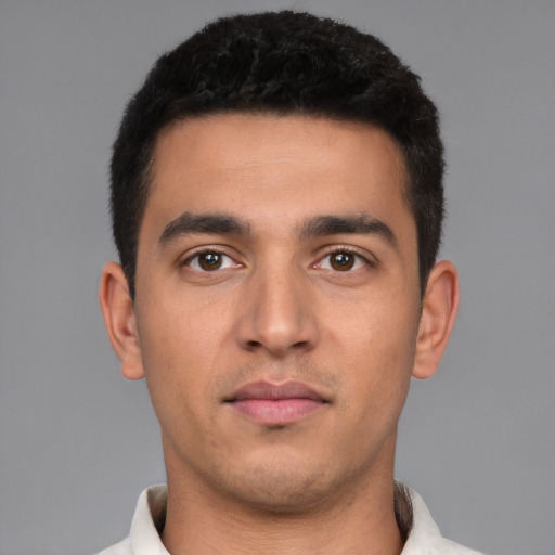 Neutral white young-adult male with short  black hair and brown eyes