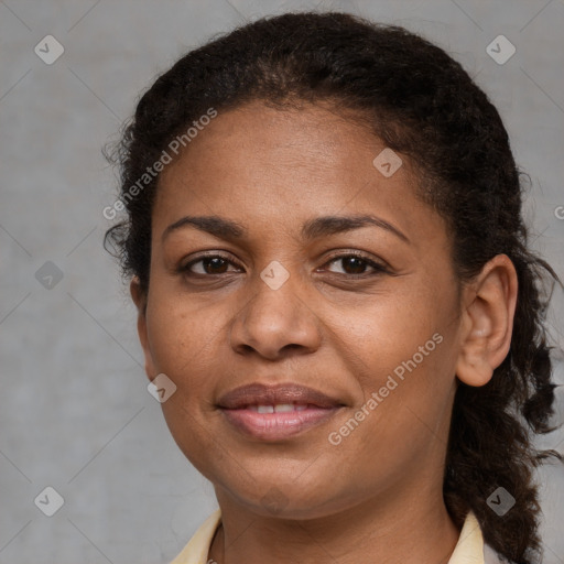 Joyful black adult female with short  brown hair and brown eyes