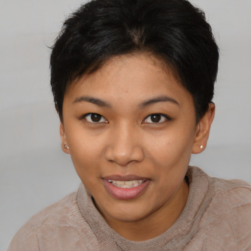 Joyful asian young-adult female with short  brown hair and brown eyes