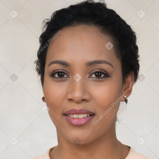 Joyful latino young-adult female with short  black hair and brown eyes